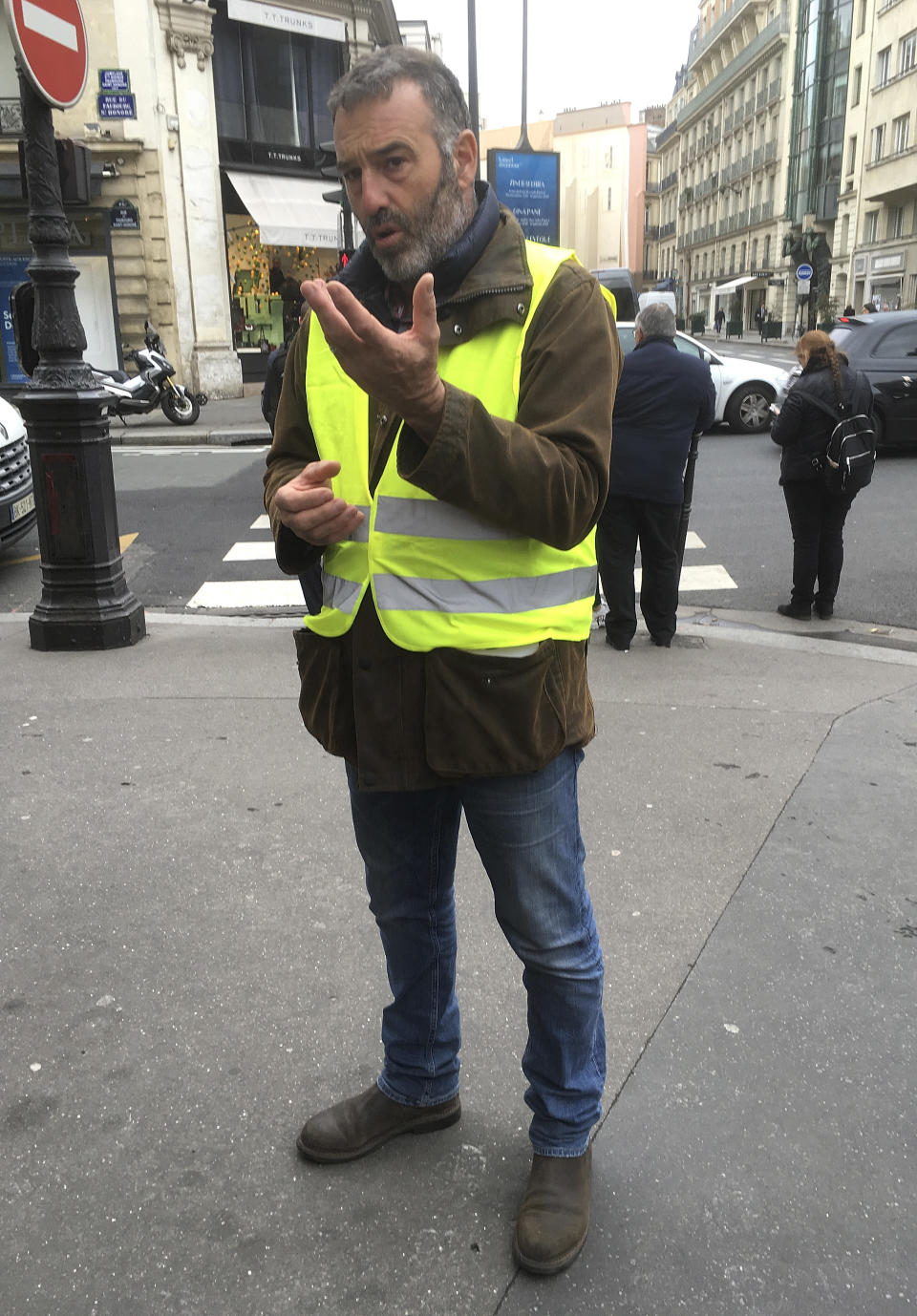 Christophe Chalencon, one of the figures at the forefront of France's protest movement, talks with The Associated Press, Wednesday, Dec. 5, 2018 in Paris. says that he fears more deaths if Saturday's demonstration goes ahead but that President Emmanuel Macron could bring calm if he speaks out. (AP Photo/Bertrand Combaldieu)