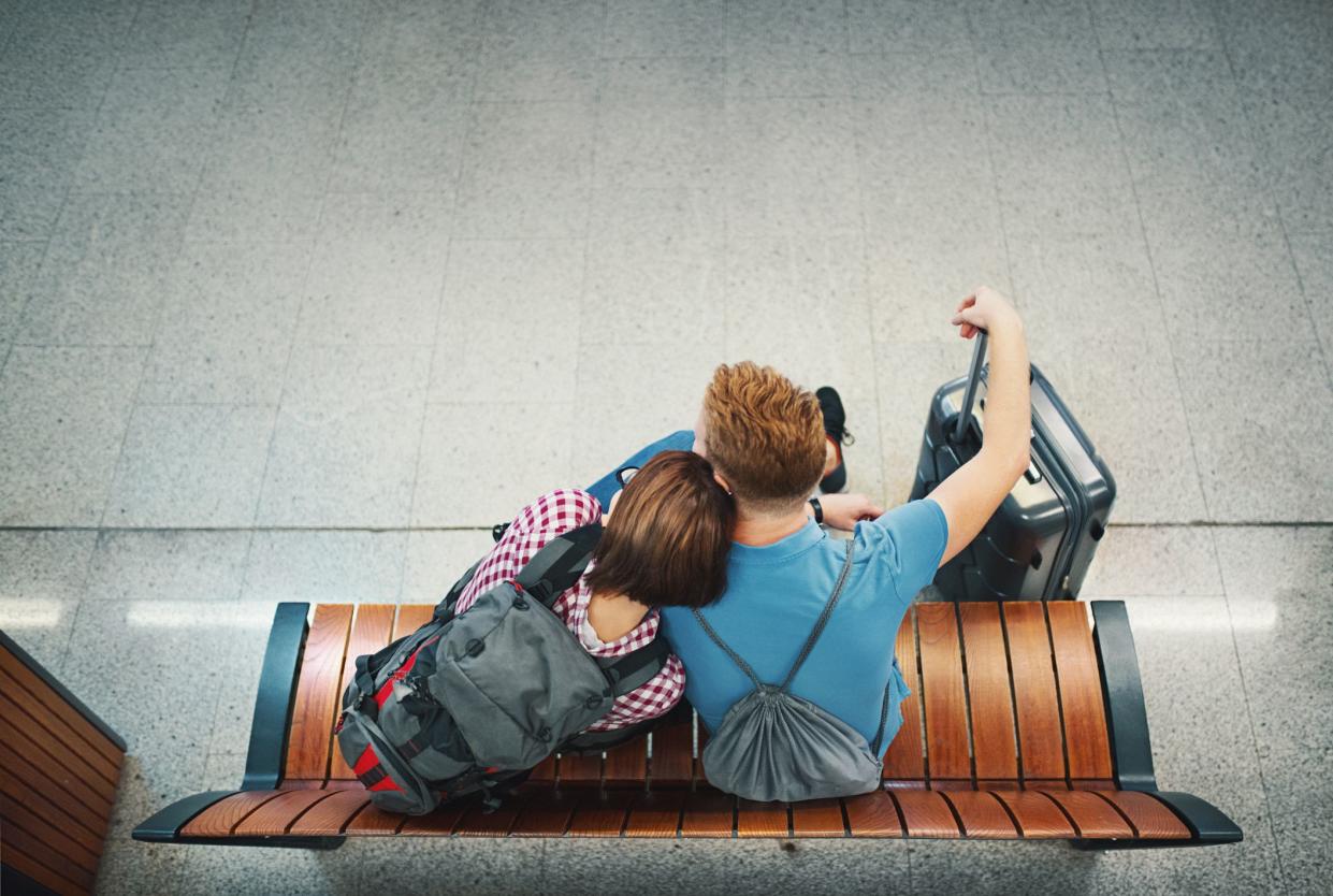 Young couple waiting for a plane