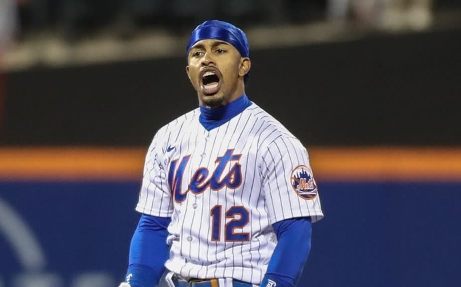 New York Mets shortstop Francisco Lindor (12) gestures towards the dugout after hitting a two run double in the fourth inning against the Washington Nationals at Citi Field.