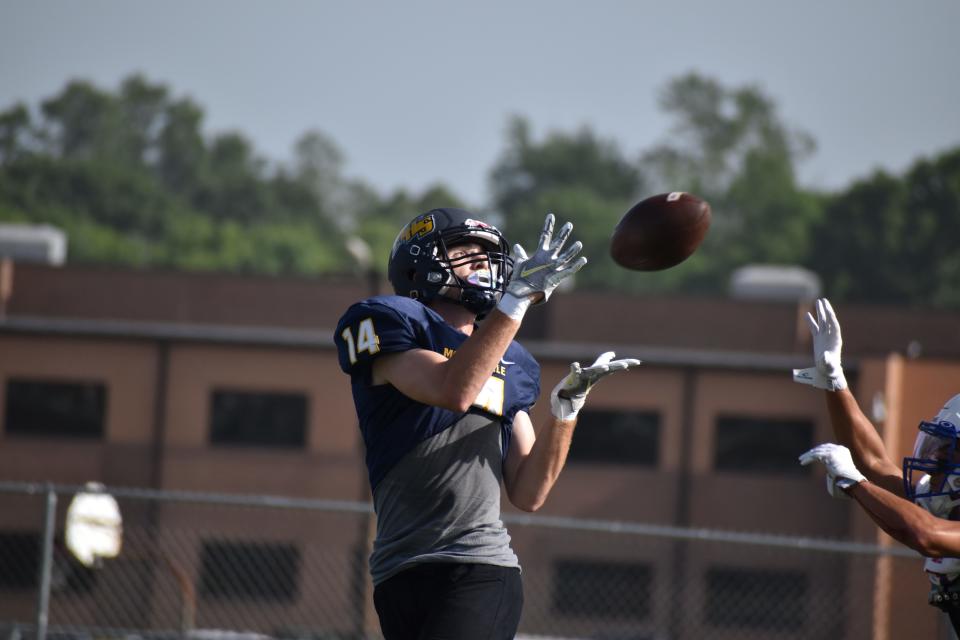 Mooresville's Levi Dorn hauls in a pass from Nick Patterson during the Pioneers' scrimmage with Indian Creek on June 15, 2022.