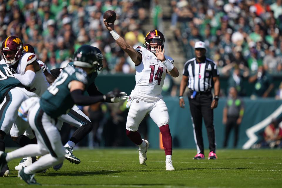 Washington Commanders quarterback Sam Howell (14) throws during the first half of an NFL football game against the Philadelphia Eagles on Sunday, Oct. 1, 2023, in Philadelphia. (AP Photo/Matt Rourke)