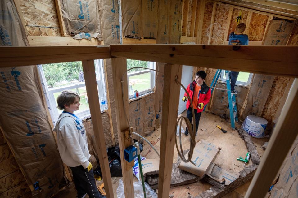 Seventh graders work inside the tiny house taking shape at  Milwaukee Jewish Day School in Whitefish Bay.