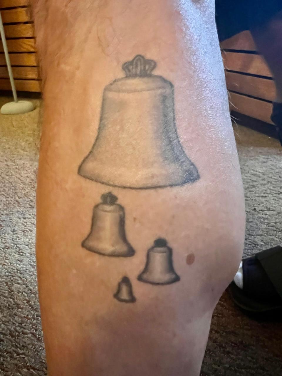 A tattoo of carillon bells on the leg of Geert D'hollander, carillonneur at Bok Tower Gardens in Lake Wales.