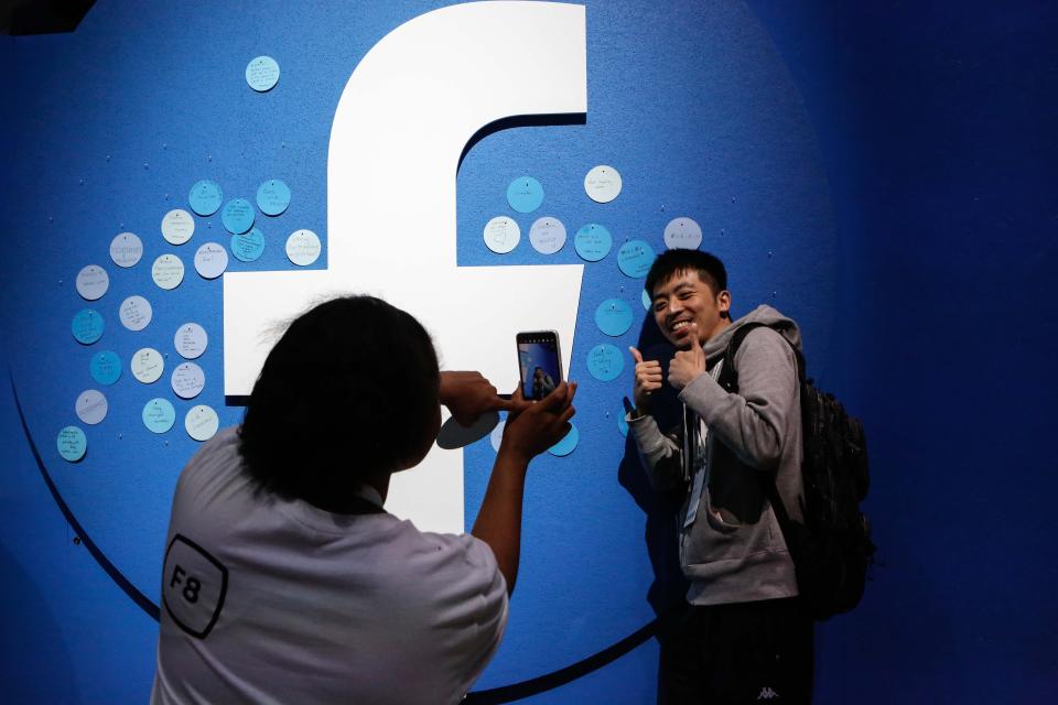 An attendee poses for a picture at the Facebook F8 Conference at McEnery Convention Center in San Jose, California, on April 30, 2019. - Got a crush on another Facebook user? The social network will help you connect, as part of a revamp unveiled Tuesday that aims to foster real-world relationships and make the platform a more intimate place for small groups of friends. (Photo by Amy Osborne / AFP)        (Photo credit should read AMY OSBORNE/AFP via Getty Images)