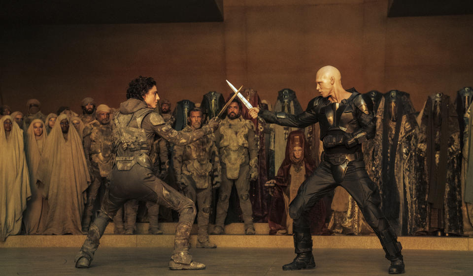 This image released by Warner Bros. Pictures shows Timothee Chalamet, foreground left, and Austin Butler in a scene from "Dune: Part Two." (Warner Bros. Pictures via AP)