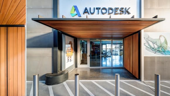 Entrance to building with Autodesk corporate logo above a wooden awning.