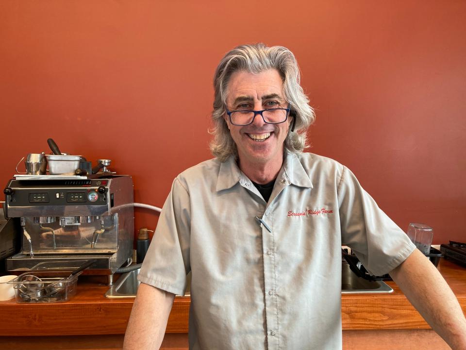 Joe Buley, owner of Cafe NOA, stands behind the counter at the Montpelier business March 8, 2023.