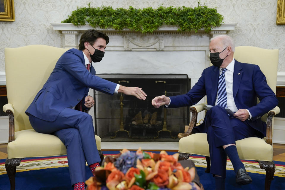 President Joe Biden shakes hands with Canadian Prime Minister Justin Trudeau as they meet in the Oval Office of the White House, Thursday, Nov. 18, 2021, in Washington. (AP Photo/Evan Vucci)