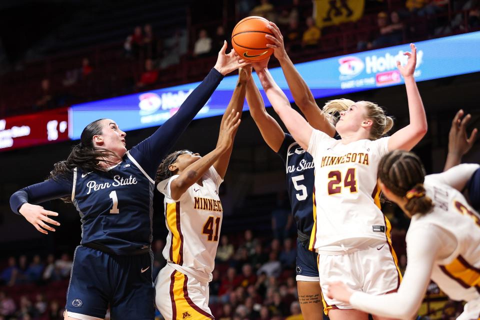 Penn State forward Ali Brigham (1), jumps for the ball in a Jan. 31 game at Minnesota. Brigham is transferring to Bryant for the 2024-25 season.