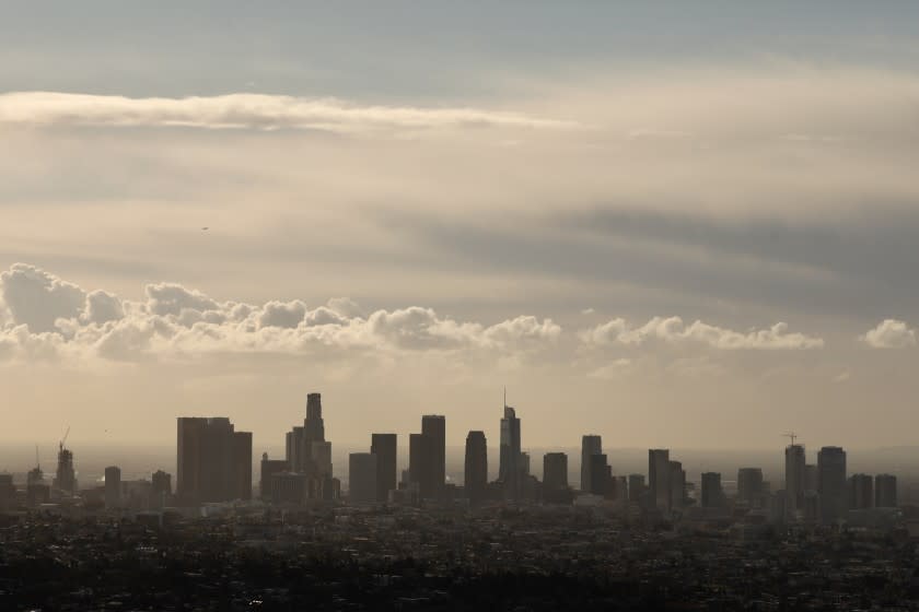 LOS ANGELES CA JANUARY 25, 2021 - Clouds drift past downtown LA seen from the Griffith Observatory in Griffith Park Monday morning, January 25, 2021, as a cold weather system moves through Southern California. (Al Seib / Los Angeles Times)