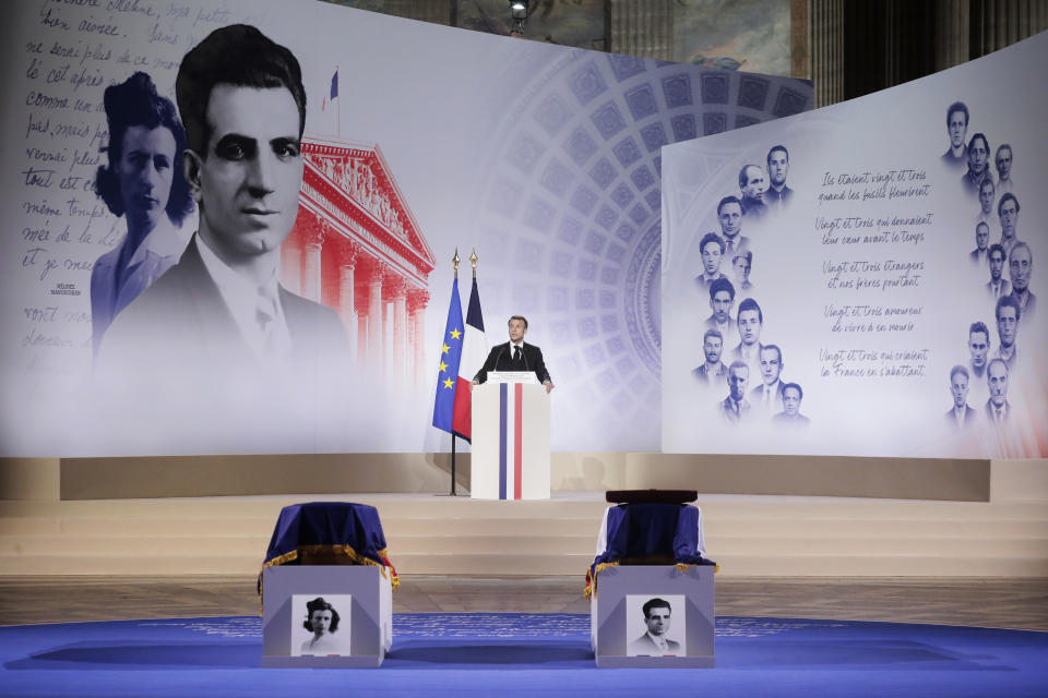 French President Emmanuel Macron speaks in front of the coffins of Missak Manouchian, his wife Mélinée lay in the Pantheon monument during their induction ceremony, Wednesday, Feb 21, 2024 in Paris. While France hosts grandiose ceremonies commemorating D-Day, Missak Manouchian and his Resistance fighters' heroic role in World War II are often overlooked. A communist, poet who took refuge in France after surviving the Armenian genocide, Manouchian was executed in 1944 for leading the resistance to Nazi occupation. (Christophe Petit Tesson/Pool via AP)