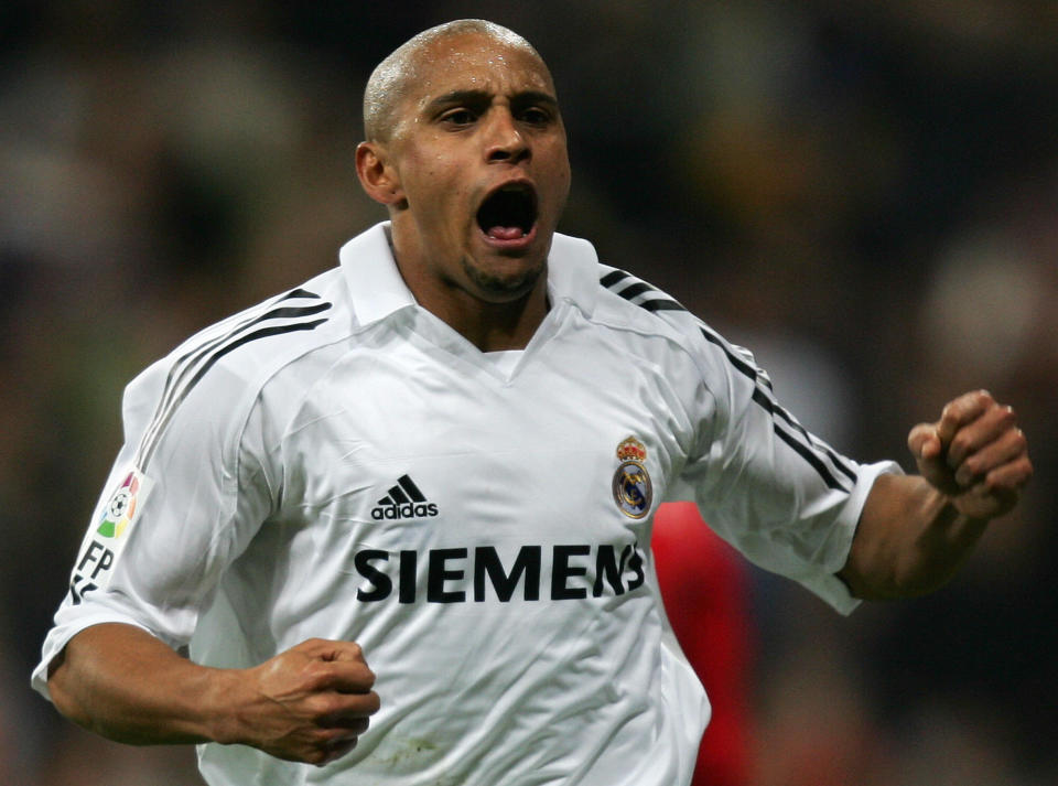 Madrid, SPAIN:  Real Madrid's Roberto Carlos reacts after his goal during the Spanish league football match against Zaragoza at the Santiago Bernabeu stadium in Madrid, 06 November 2005. Real won 1-0                  AFP PHOTO/PHILIPPE DESMAZES  (Photo credit should read PHILIPPE DESMAZES/AFP/Getty Images)