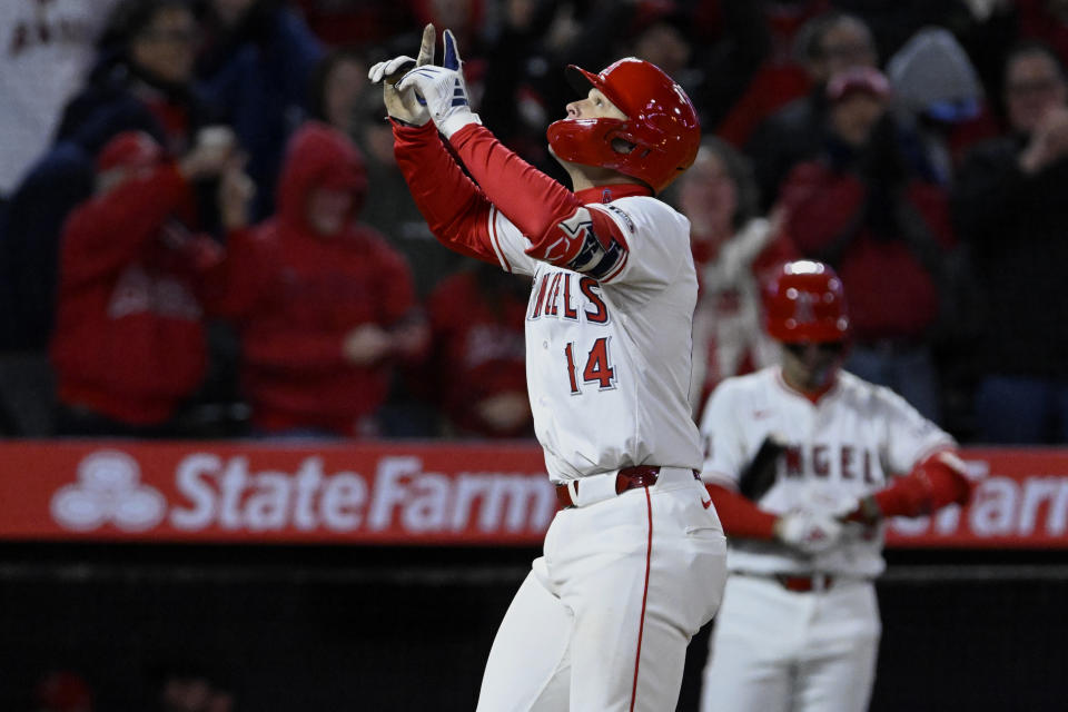 Los Angeles Angels' Logan O'Hoppe gestures as he scores on his grand slam against the Boston Red Sox during the sixth inning of a baseball game in Anaheim, Calif., Friday, April 5, 2024. (AP Photo/Alex Gallardo)