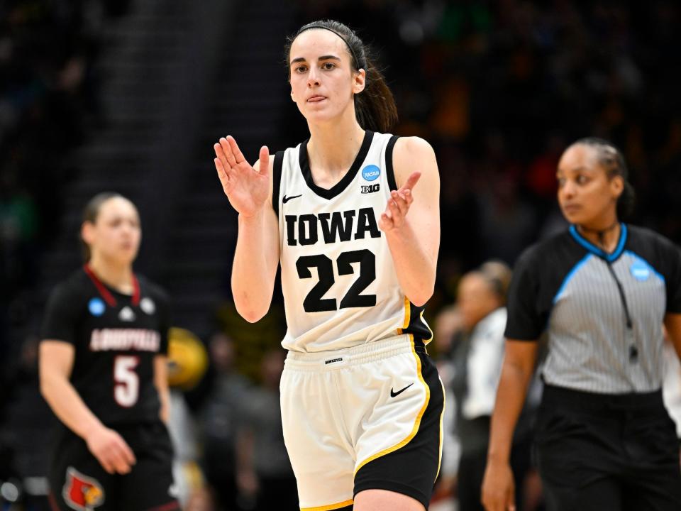 Caitlin Clark celebrates a play during Iowa's Elite Eight game.