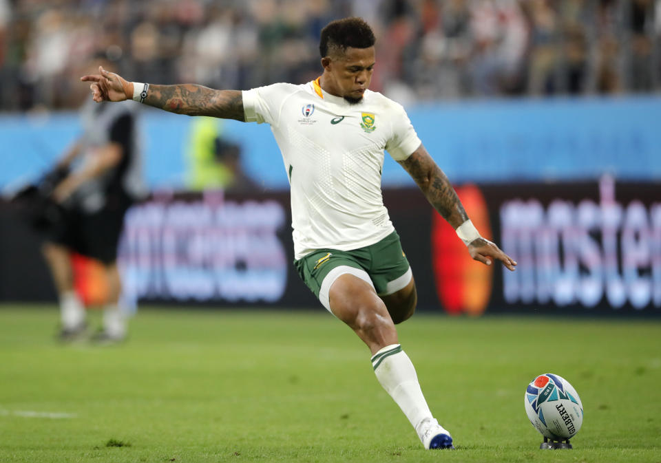 South Africa's Elton Jantjies kicks a conversion during the Rugby World Cup Pool B game at the City of Toyota Stadium between South Africa and Namibia in Toyota City, Japan, Saturday, Sept. 28, 2019. (AP Photo/Christophe Ena)