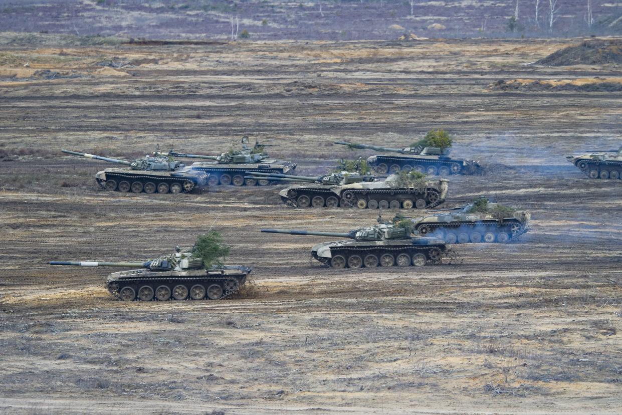 Tanks and armored vehicles move during the Union Courage-2022 Russia-Belarus military drills at the Obuz-Lesnovsky training ground in Belarus, Saturday, Feb. 19, 2022.