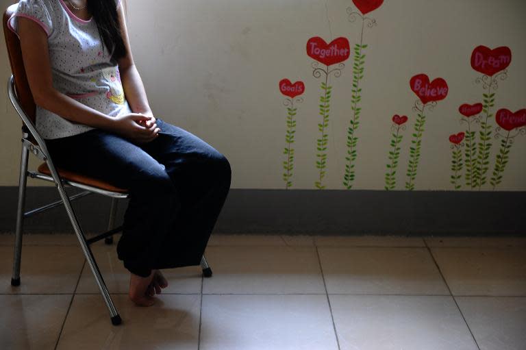 H'mong ethnic teenager May Na (whose name has been changed to protect her identity) sits in the living room at a government-run centre for trafficked women in the northern Vietnamese city of Lao Cai, May 9, 2014