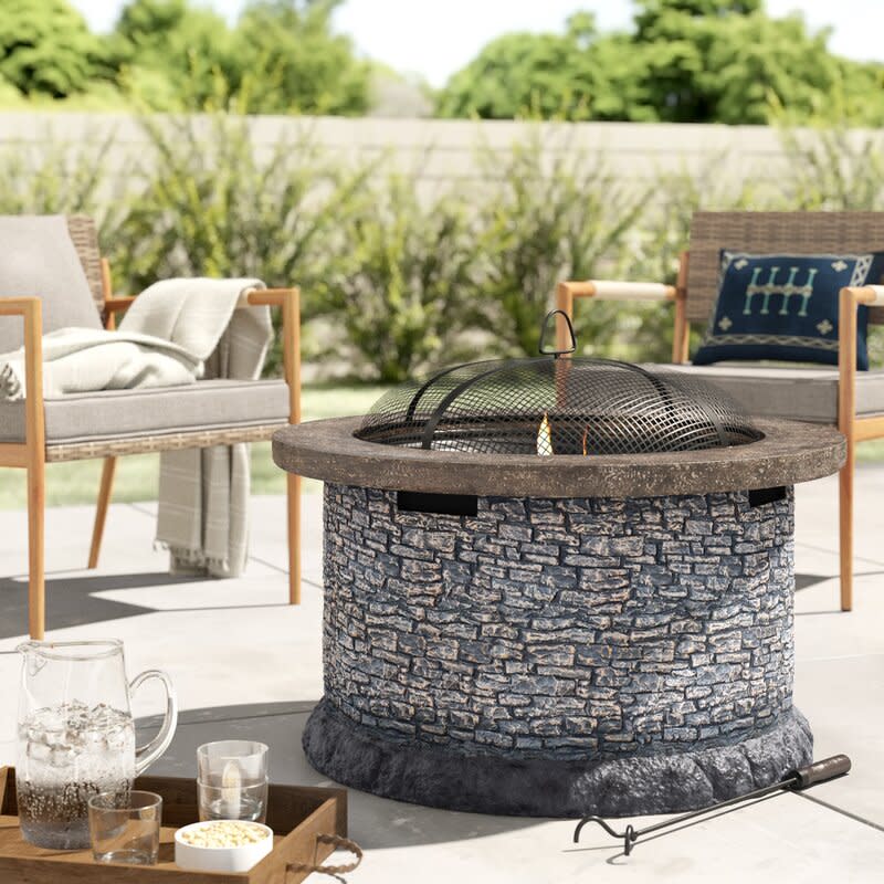 <p><a href="https://clicks.trx-hub.com/xid/hearstcorp_9eb67_clg?q=https%3A%2F%2Fwww.wayfair.com%2Foutdoor%2Fpdp%2Fwilliston-forge-nolia-stone-32-in-round-wood-burning-firepit-w005273680.html&p=https%3A%2F%2Fwww.countryliving.com%2Fshopping%2Fg37026239%2Fbest-outdoor-fire-pits%2F&utmSource=yahoo-us&utmCampaign=55&utmMedium=syn" rel="nofollow noopener" target="_blank" data-ylk="slk:Shop Now;elm:context_link;itc:0;sec:content-canvas" class="link rapid-noclick-resp">Shop Now</a></p><p>Nolia Concrete Wood Burning Fire Pit</p><p>wayfair.com</p><p>$549.99</p>