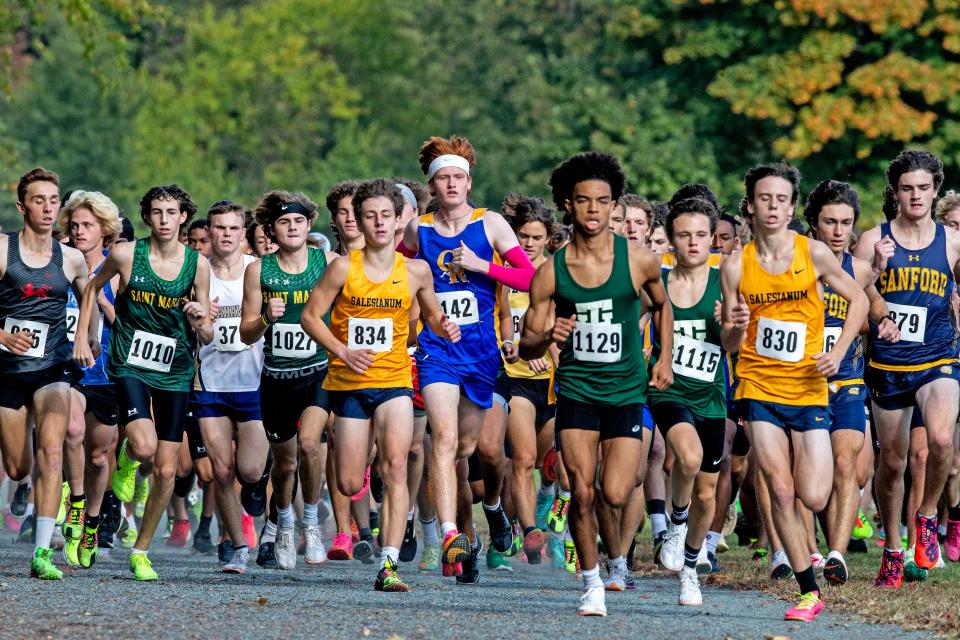 The Boys Varsity runners take off to compete in the 2023 Joe O'Neill Invitational cross country race at Bellevue State Park in Wilmington, Thursday, Oct. 19, 2023.