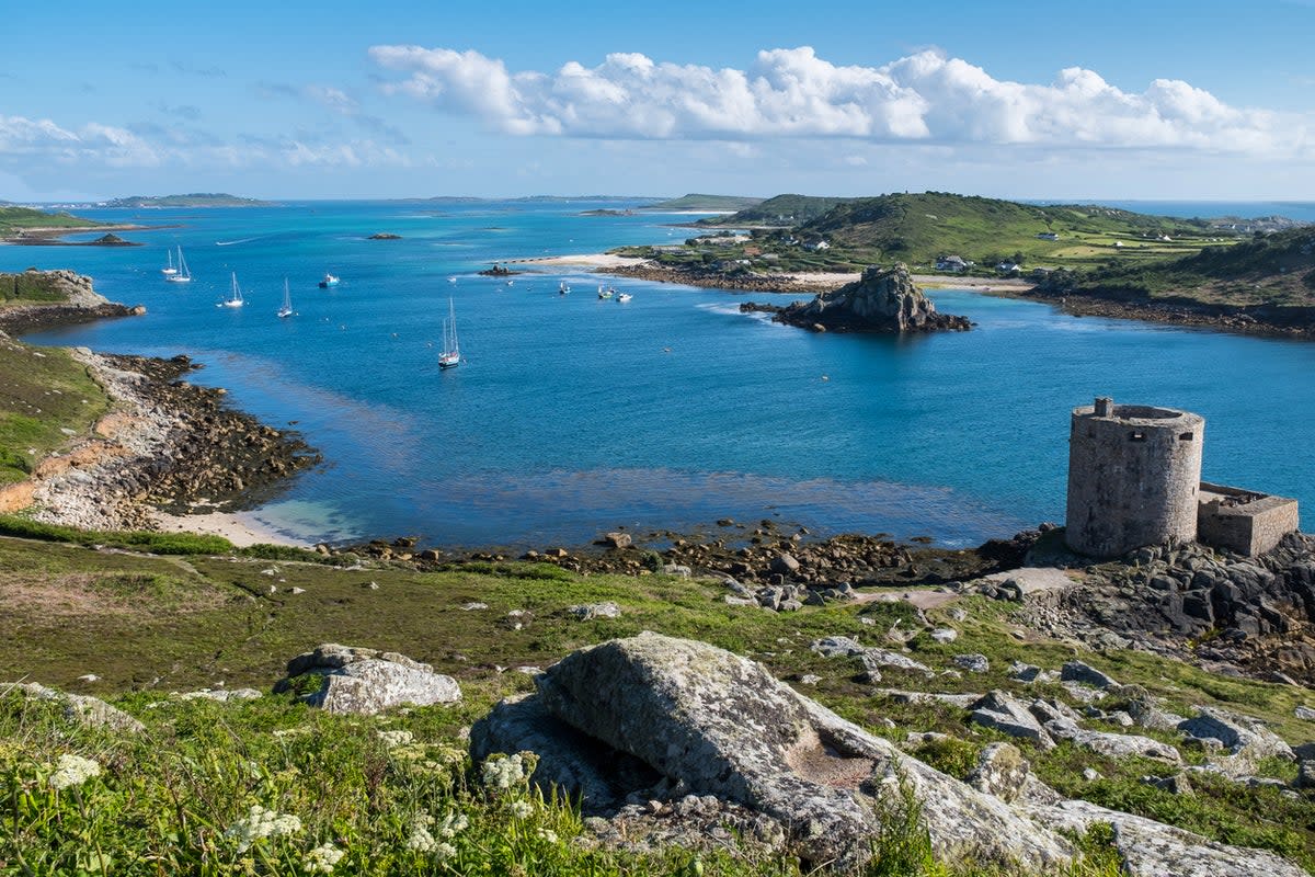 A view over part of Tresco, showing Cromwell’s Castle and the Isle of Bryher (Getty Images/iStockphoto)