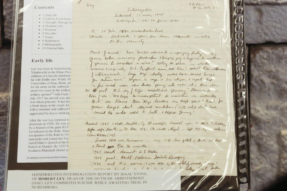 A handwritten notice by Isaac Stone, who headed the Berlin Document Center and the U.S. Foreign Service Office in the 1940s, of the interrogation of Nazi leader Robert Ley, is on display at the Jewish Educational Center in Berlin, Wednesday, Jan. 22, 2014. A collection of documents used by prosecutors at the Nuremberg Trials to help convict top Nazis is being put on public display in Berlin ahead of its auction in Israel. The Berlin Jewish Education Center says the documents going on display Wednesday were discovered by a collector at a flea market in Israel a half year ago and are to be auctioned Jan. 29. Many are English translations of Nazi documents used by prosecutors in their cases against Nazis like Hermann Goering and Rudolf Hess, who were convicted at the international tribunal after the war. (AP Photo/Markus Schreiber)