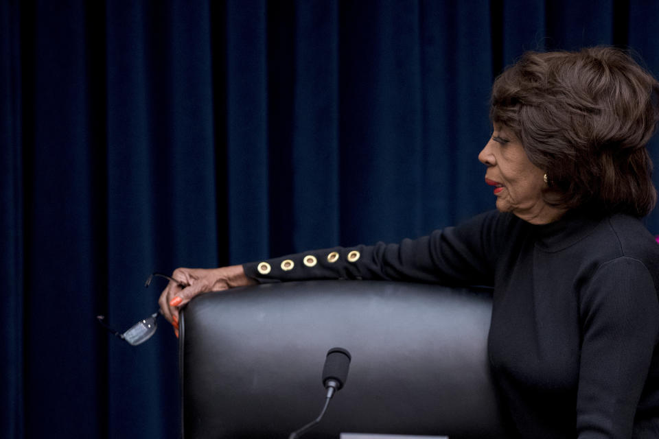 Chairwoman Rep. Maxine Waters, D-Calif., appears before Facebook CEO Mark Zuckerberg arrives for a House Financial Services Committee hearing on Capitol Hill in Washington, Wednesday, Oct. 23, 2019, on Facebook's impact on the financial services and housing sectors. (AP Photo/Andrew Harnik)