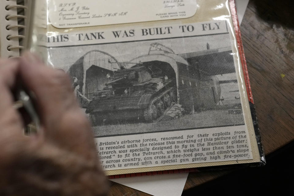 D-Day veteran Bill Gladden show a page in his scrapbook, showing the type of glider he landed in Normandy on D-Day, at his home in Haverhill, England, Friday, Jan. 12, 2024. Gladden spoke to the AP on the eve of his 100th birthday, he is a veteran of the 6th Airborne Armoured Reconnaissance Regiment, part of the British 6th Airborne Division, he landed by glider on the afternoon of D-Day, 6th June 1944 in Normandy. (AP Photo/Alastair Grant)