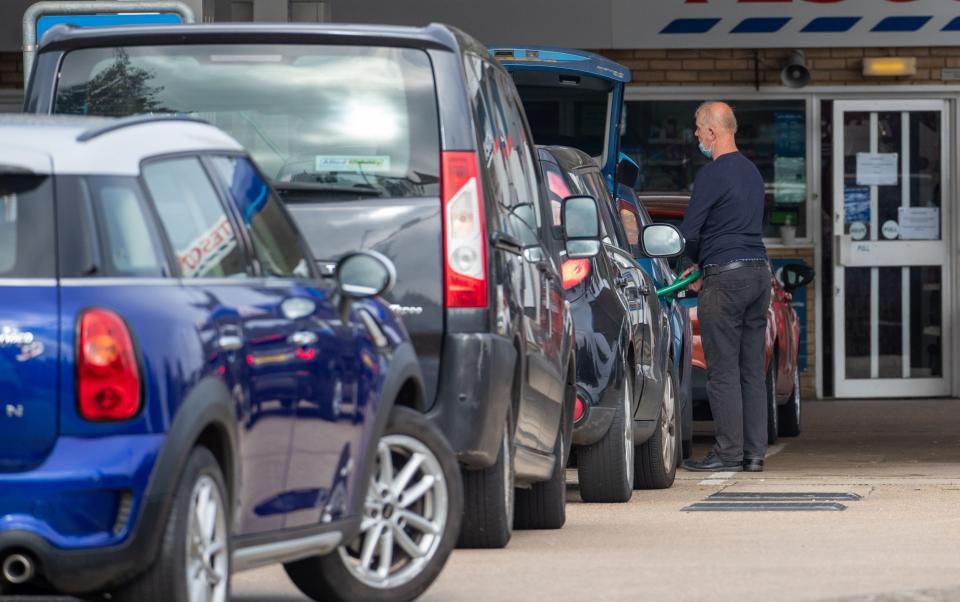 Queues for fuel at the Tesco petrol station in Ely, Cambridgeshire, on Friday morning - Geoff Robinson