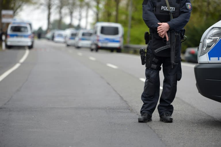 Policemen secure the area around Borussia Dortmund's team hotel in Dortmund, western Germany, on April 12, 2017