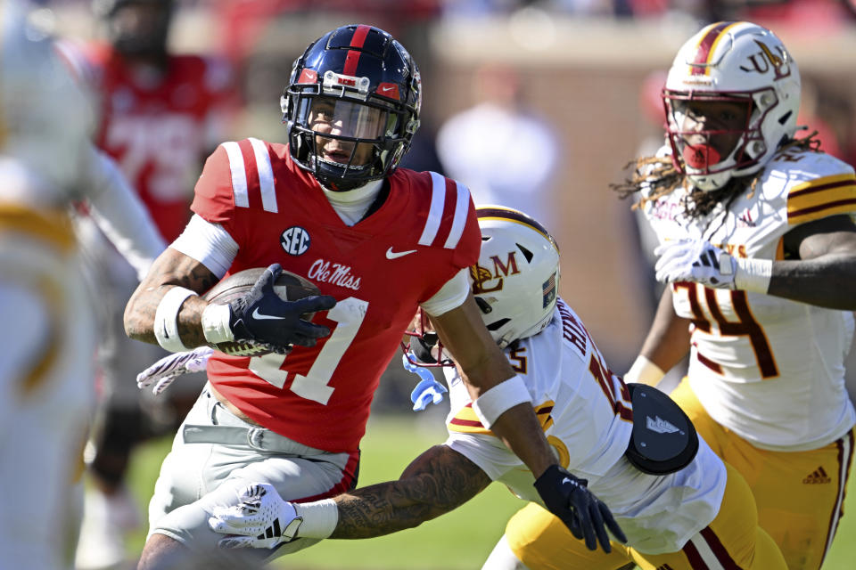 Louisiana Monroe safety Simion Hines (15) tackles Mississippi wide receiver Jordan Watkins (11) after a catch during the first half of an NCAA college football game in Oxford, Miss., Saturday, Nov. 18, 2023. (AP Photo/Thomas Graning)