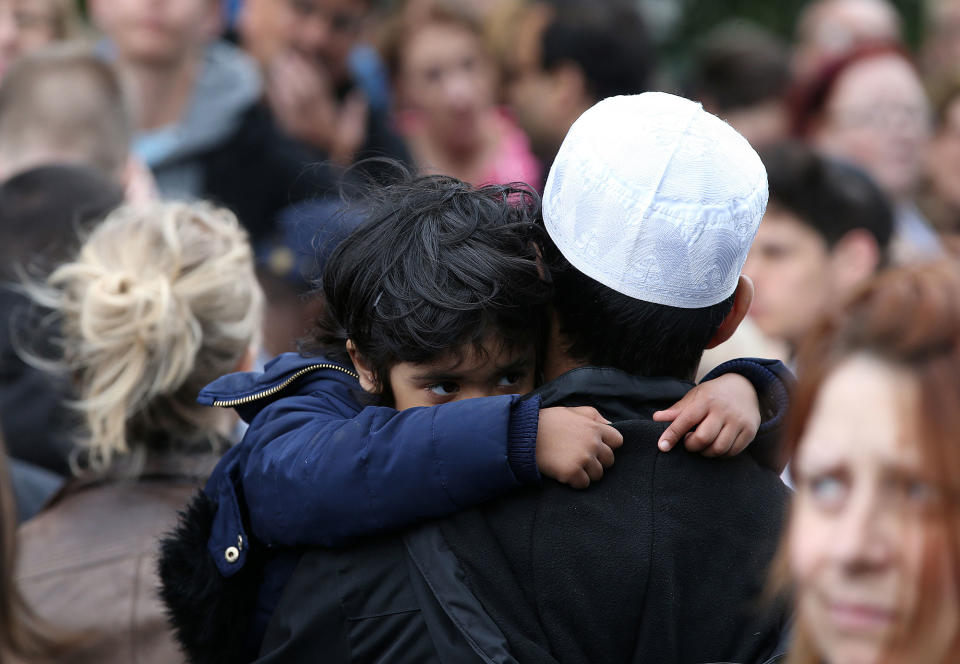 People attend a vigil to remember the victims