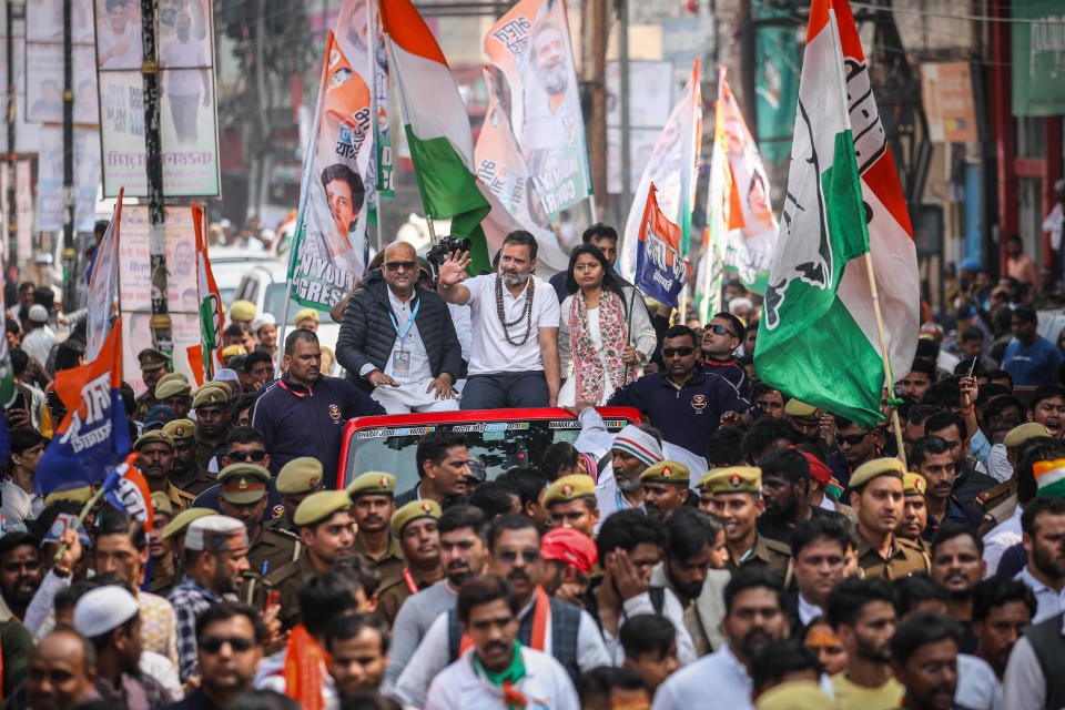 India's Congress Party leader Rahul Gandhi (sitting atop a vehicle and waving) takes part in a procession during a campaign tour, Feb. 17, 2024, in Varanasi, India. / Credit: ABHISHEK MISHRA/Getty