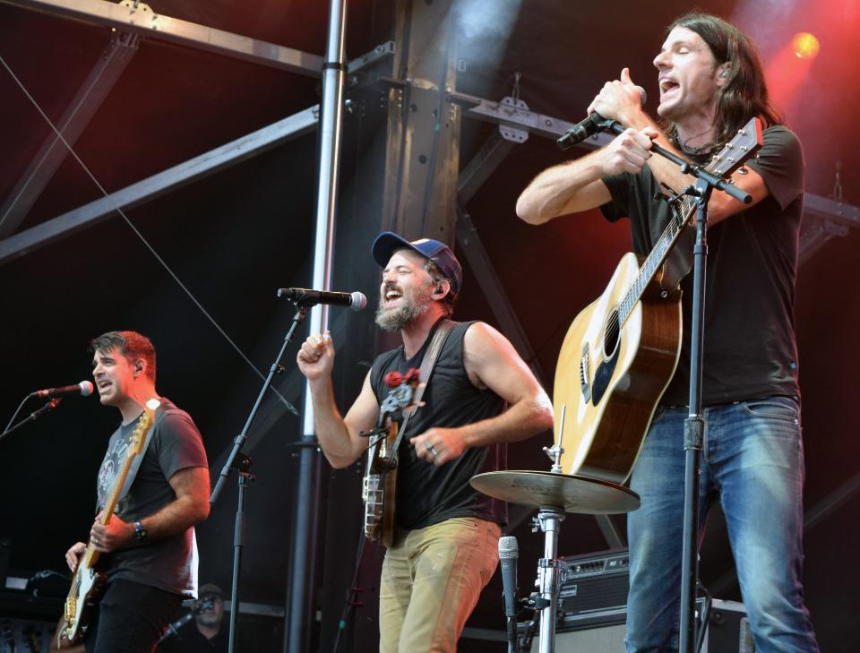 Band members Bob Crawford, Scott Avett and Seth Avett sing as the Avett Brothers band performs Friday evening at the Beach Road Weekend music festival in Vineyard Haven.