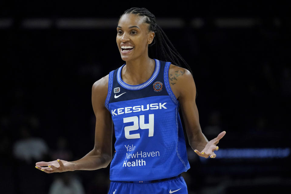 Connecticut Sun forward DeWanna Bonner (24) reacts toward= a referee after a turnover during the first half of the Commissioner's Cup WNBA basketball game against the Seattle Storm, Thursday, Aug. 12, 2021, in Phoenix. (AP Photo/Matt York)