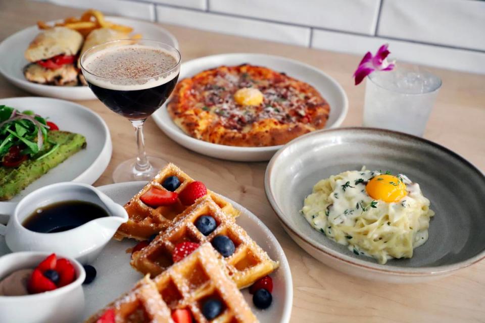 Brunch items at Il Modo include a pizza, waffle, avocado toast and chicken sandwich.