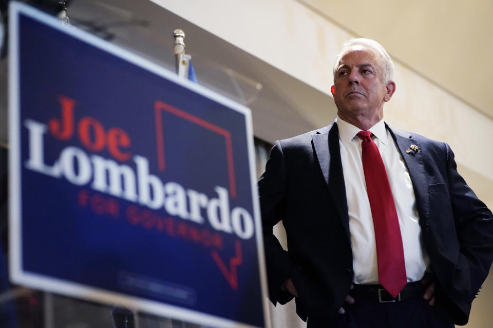 Joe Lombardo, Clark County sheriff and a candidate for the Republican nomination for Nevada governor, stand on stage during a primary-night party Tuesday, June 14, 2022, in Las Vegas. (AP Photo/John Locher)