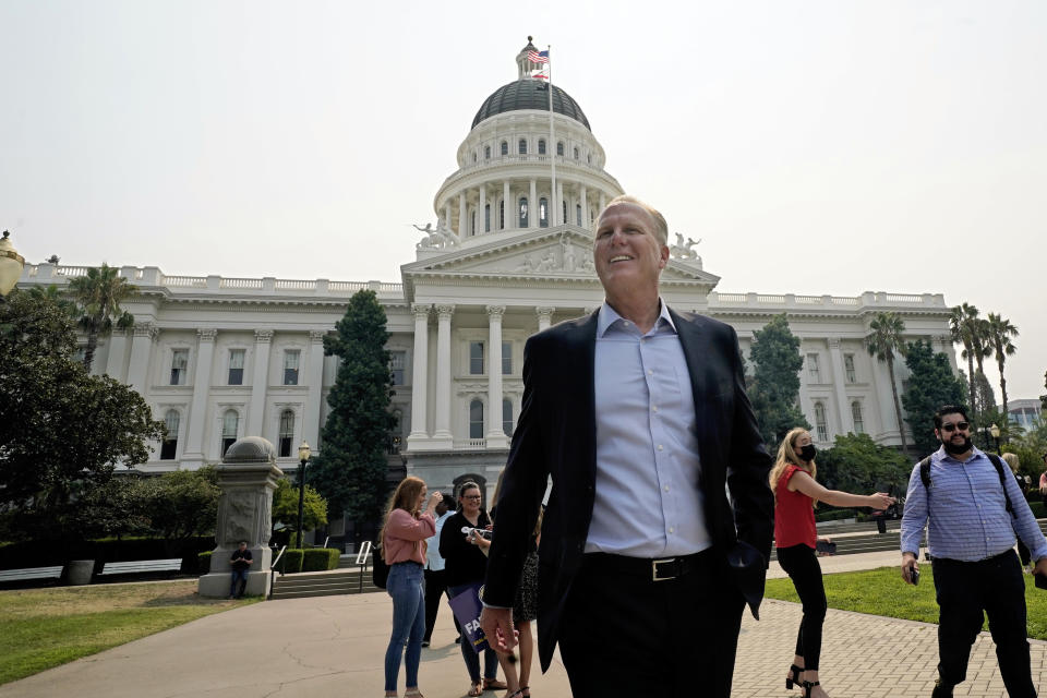 Republican Kevin Faulconer, a candidate for governor in the California recall election, leaves the state Capitol after meeting with supporters in Sacramento, Calif., Friday, Aug. 20, 2021. Faulconer continued his criticism of Republican rival Larry Elder over past comments he's made about women in the workplace. (AP Photo/Rich Pedroncelli)