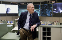 Gene Kranz, aerospace engineer, fighter pilot, an Apollo-era flight director and later director of NASA flight operations leans on a console near the one where he worked in the mission control room at the NASA Johnson Space Center Monday, June 17, 2019, in Houston. The site is being restored to how it was 50 years ago for the Apollo 11 moon landing. (AP Photo/Michael Wyke)