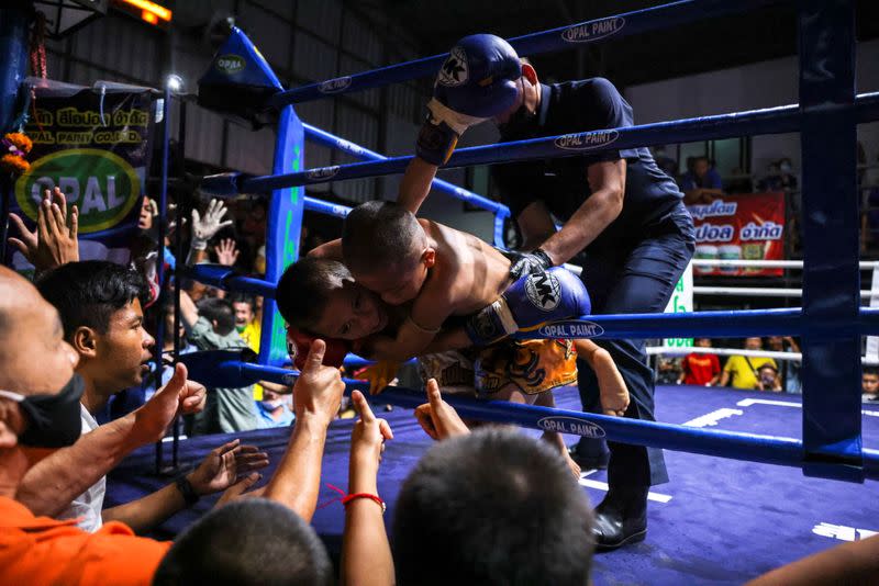 The Wider Image: Punching out of poverty: Despite risks, nine-year-old Thai fighter eager to return to ring