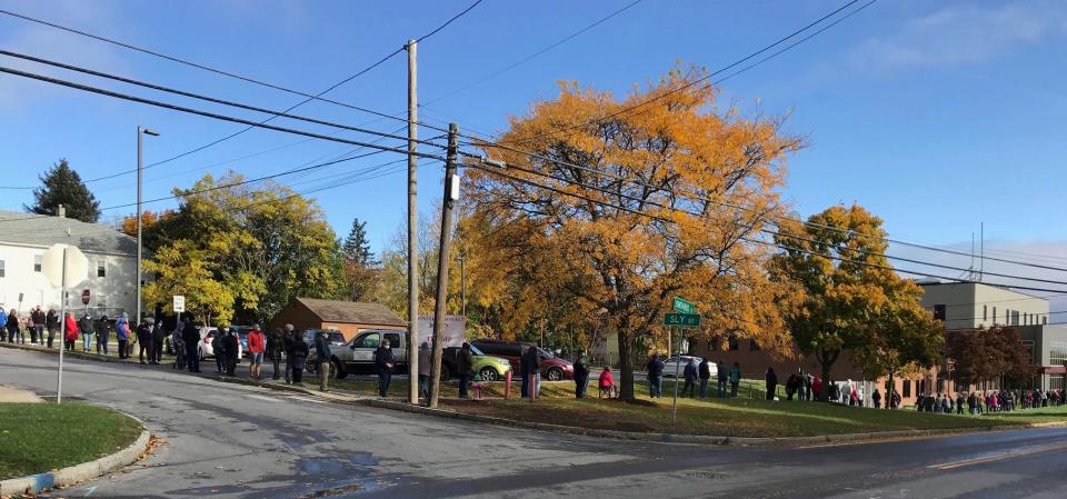 In this file photo, voters form a line that wraps around the block outside the Ontario County Board of Elections office in Canandaigua.