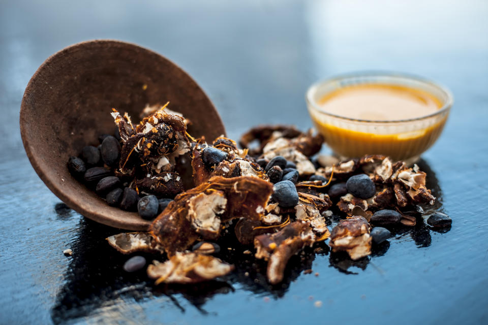 Tamarind paste (in the bowl at right) is extracted from the tamarind fruit. (Photo: mirzamlk via Getty Images)