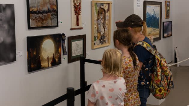 Fairgoers check out Allen's winning artwork in Pueblo, Colorado. (Photo: Colorado State Fair)