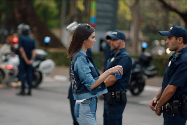 Kendall Jenner makes the peace in the pulled Pepsi advert (Picture: Pepsi)