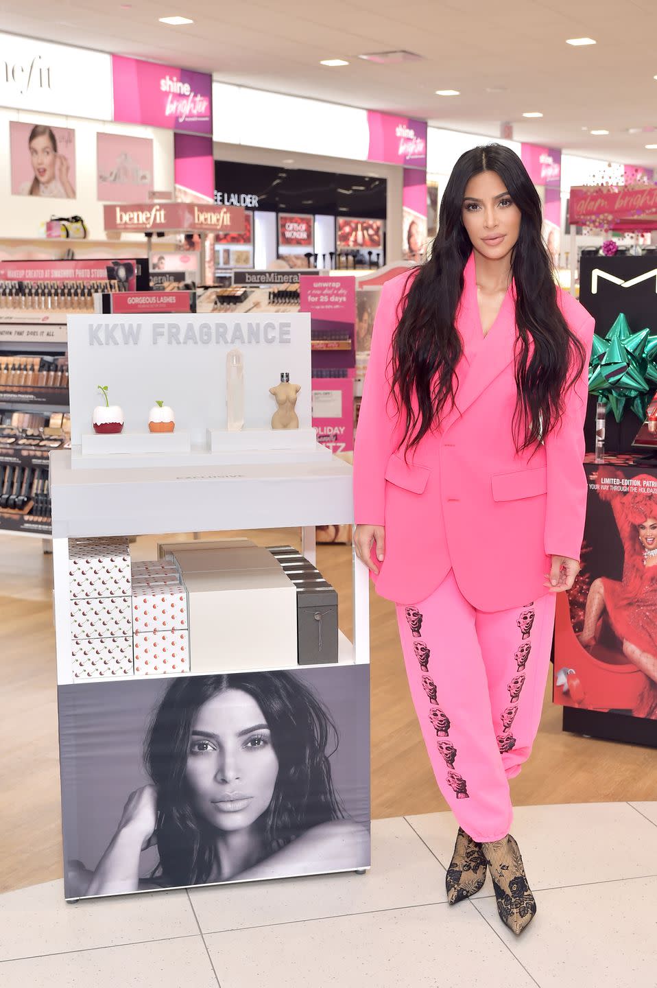 <p>In a hot pink suit jacket with pink sweatpants featuring pictures of little heads, launching <a rel="nofollow noopener" href="https://www.harpersbazaar.com/celebrity/latest/a25295627/kim-kardashian-north-west-dream-kardashian-instagram-makeup-videos/" target="_blank" data-ylk="slk:KKW Beauty;elm:context_link;itc:0;sec:content-canvas" class="link ">KKW Beauty</a> at ULTA Beauty in Calabasas, California. </p>