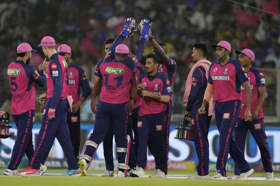Players of Rajasthan Royals celebrate the dismissal of Royal Challengers Bengaluru's captain Faf du Plessis during the Indian Premier League eliminator cricket match between Royal Challengers Bengaluru and Rajasthan Royals in Ahmedabad, India, Wednesday, May 22, 2024. (AP Photo/Ajit Solanki)