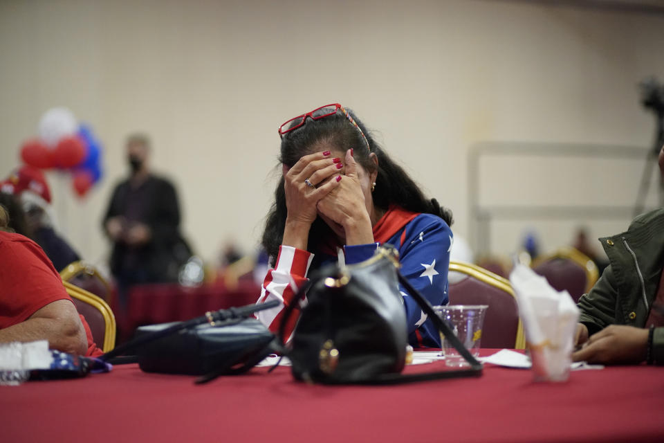 President Donald Trump supporter Loretta Oakes reacts while watching returns in favor of Democratic presidential candidate former Vice President Joe Biden, at a Republican election-night watch party, Tuesday, Nov. 3, 2020, in Las Vegas. (AP Photo/John Locher)