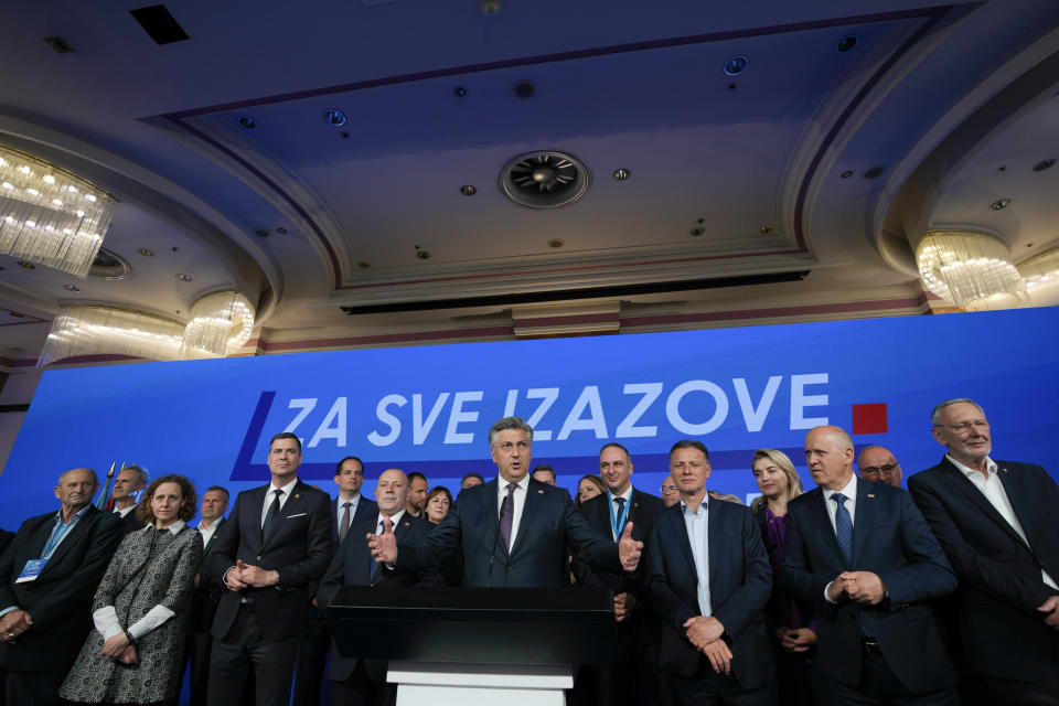 Prime Minister incumbent Andrej Plenkovic, center, speaks after claiming victory in a parliamentary election in Zagreb, Croatia, Thursday, April 18, 2024. Croatia's governing conservatives convincingly won a highly contested parliamentary election Wednesday, but will still need support from far-right groups to stay in power, according to the official vote count. The election followed a campaign that centered on a bitter rivalry between the country's president and prime minister. (AP Photo/Darko Vojinovic)