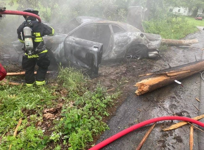 Two off-duty firefighters and an East Kingston police officer pulled 35-year-old Jamaica Johnson from her burning Dodge Challenger on Route 107 Saturday, according to East Kingston police and fire.