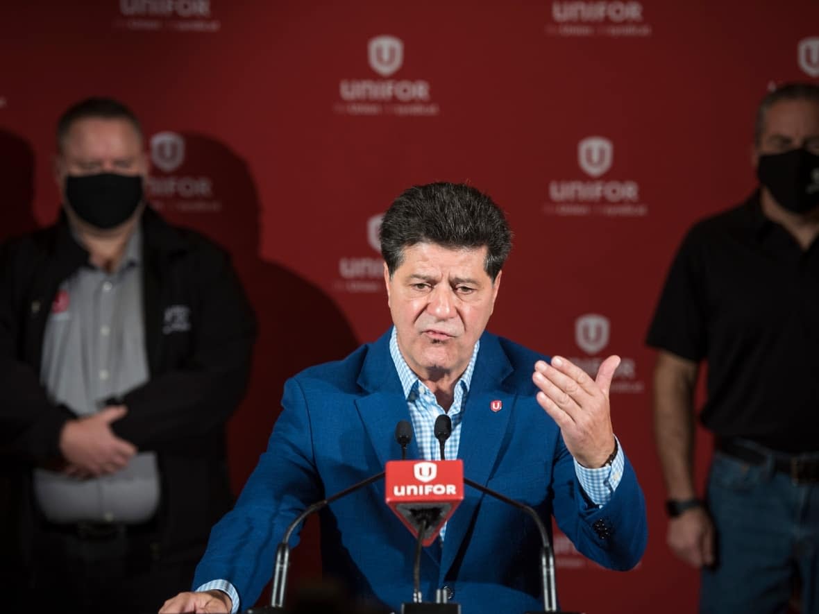 Unifor national president Jerry Dias gestures during a press conference announcing a tentative agreement for 9,000 members working at Fiat Chrysler Automobiles, averting a midnight strike at its Canadian plants,  in Toronto on Thursday, Oct. 15, 2020.  (Tijana Martin/The Canadian Press - image credit)