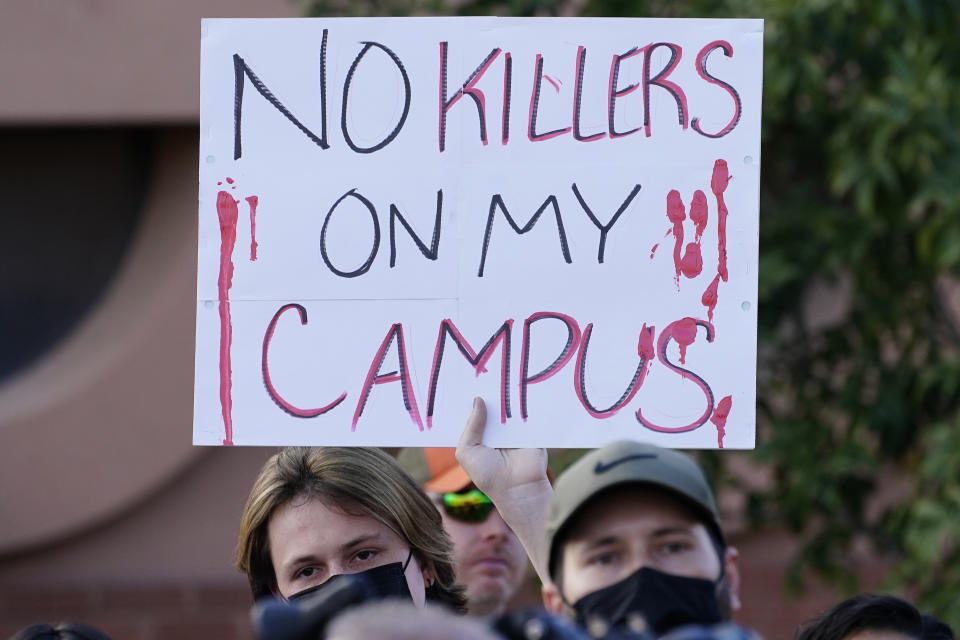 Students for Socialism protest on campus demanding that Kyle Rittenhouse not be allowed to enroll at Arizona State University, Wednesday, Dec. 1, 2021, at ASU in Tempe, Ariz. Protesters were demanding the university disavow the 18-year-old, who was acquitted of murder last month in the deadly shootings during last year's unrest in Kenosha. (AP Photo/Matt York)